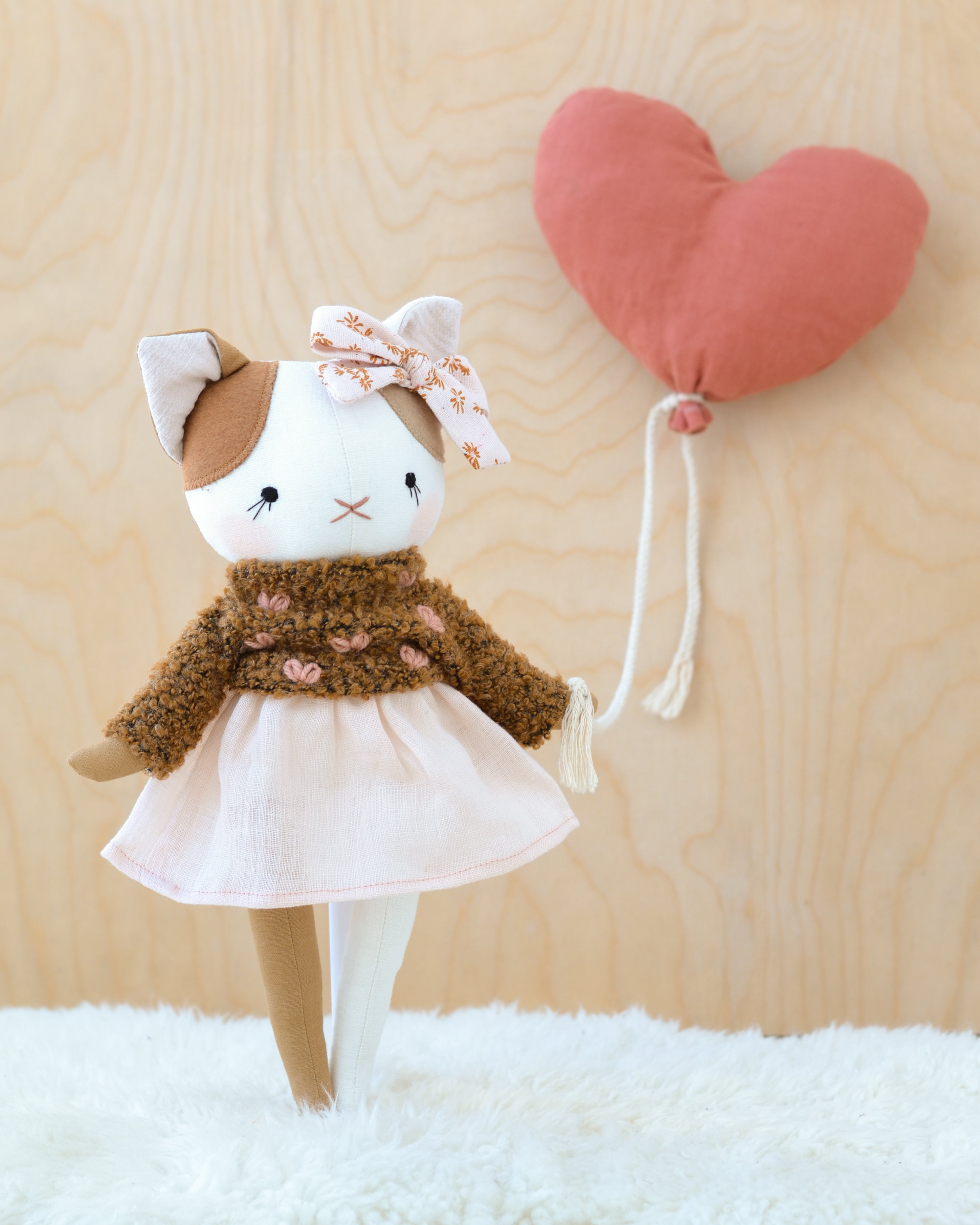 Cat Doll in a Pink Skirt and Heart Sweater